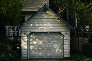 Loan closing survey for a home with a detached garage in Arlington, Virginia, showing the separate garage, nearby house, and residential access area.